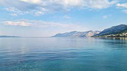 Image showing Beautiful shore of the Adriatic Sea. Bay view with cloudscape. Sunrise