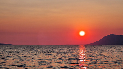 Image showing Beautiful red sunset over the Adriatic sea. Makarska Riviera-Biokovo, Dalmatia, Croatia, Europe