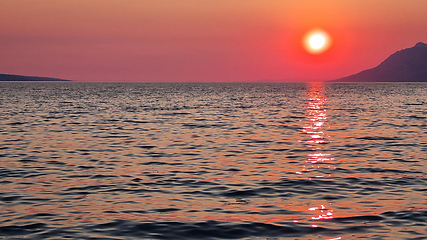 Image showing Beautiful red sunset over the Adriatic sea. Makarska Riviera-Biokovo, Dalmatia, Croatia, Europe