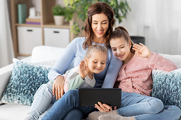 Image showing mother and children having video call on tablet pc