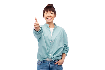 Image showing happy asian woman showing thumbs up over white