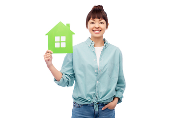 Image showing smiling asian woman holding green house