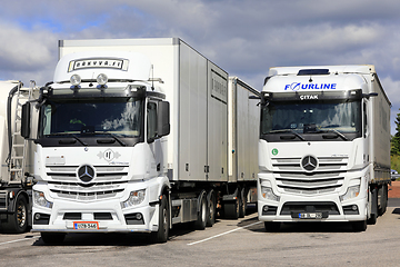 Image showing Two White Mercedes-Benz Actros Heavy Trucks Parked