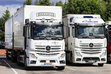 Image showing Two White Mercedes-Benz Actros Freight Trucks Parked