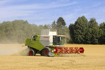 Image showing Claas Tucano 570 Combine Harvester in Wheat Field