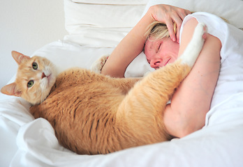 Image showing Female beauty sleeping with her cat.