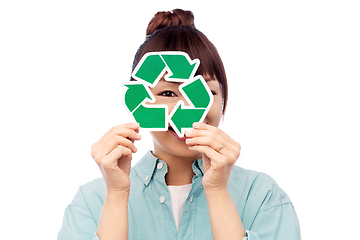 Image showing smiling asian woman holding green recycling sign