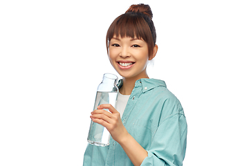 Image showing happy asian woman holding glass bottle with water