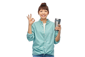 Image showing woman with thermo cup or tumbler showing ok sign