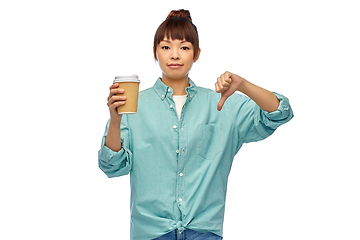 Image showing asian woman with coffee cup showing thumbs down