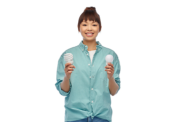 Image showing asian woman holding energy saving lighting bulb