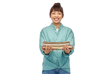 Image showing smiling young asian woman sorting paper waste