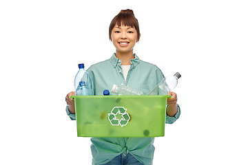 Image showing smiling young asian woman sorting plastic waste