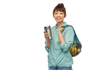 Image showing woman with thermo cup or tumbler for hot drinks