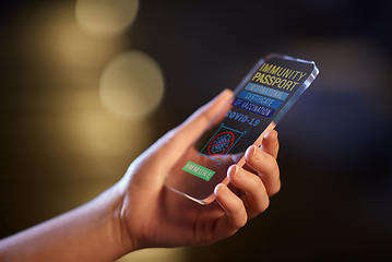 Image showing hand holding phone with certificate of vaccination