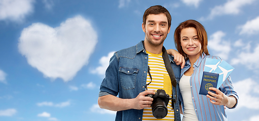 Image showing couple with tickets, immunity passport and camera