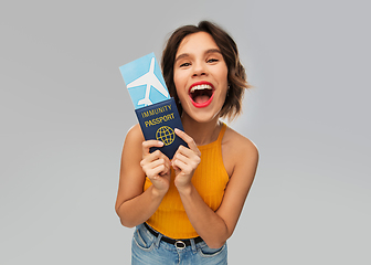 Image showing happy woman with air ticket and immunity passport