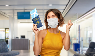 Image showing woman in mask with ticket and immunity passport