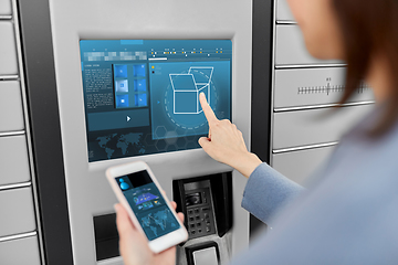 Image showing woman with smartphone at automated parcel machine