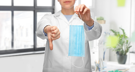 Image showing doctor with mask showing thumbs down at hospital