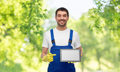 Image showing happy male worker or cleaner showing tablet pc