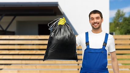 Image showing happy male worker or cleaner showing garbage bag