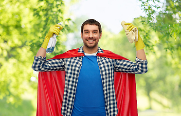 Image showing smiling man in superhero cape with rag and cleaner