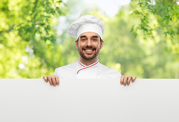 Image showing happy smiling male chef with big white board