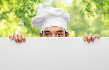 Image showing male chef hiding behind big white board