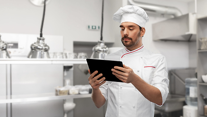 Image showing male chef with tablet pc at kitchen