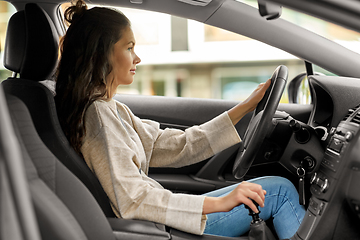 Image showing woman or female driver driving car in city