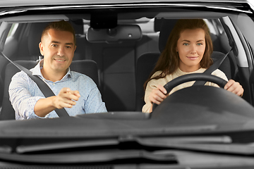 Image showing car driving school instructor teaching woman