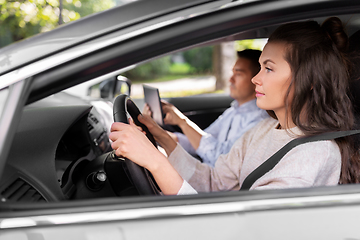 Image showing car driving school instructor teaching woman