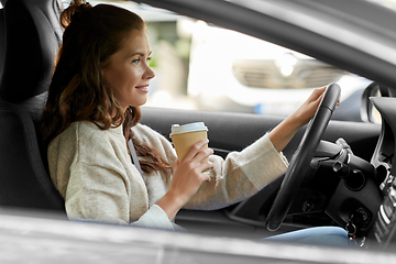 Image showing woman or female driver with coffee driving car