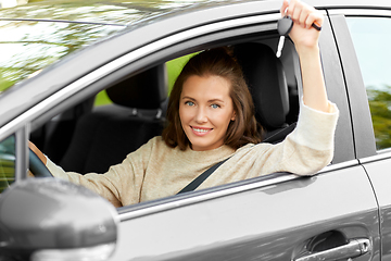 Image showing woman or female driver with car key in city