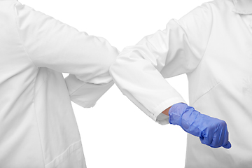 Image showing close up of doctors make elbow bump gesture