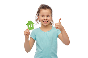 Image showing happy girl with green house icon showing thumbs up