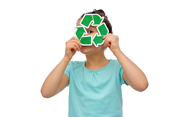 Image showing curious girl looking through green recycling sign