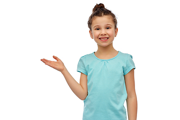 Image showing happy smiling girl holding something imaginary