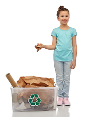 Image showing smiling girl sorting paper waste