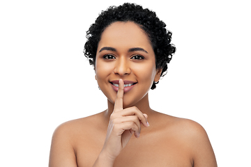 Image showing young african american woman with finger on lips