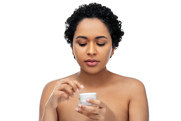 Image showing young african american woman with moisturizer