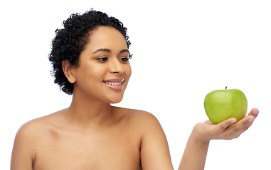 Image showing happy african american woman holding green apple