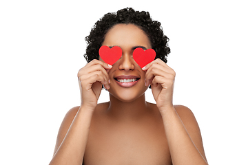 Image showing african american woman covering eyes with hearts