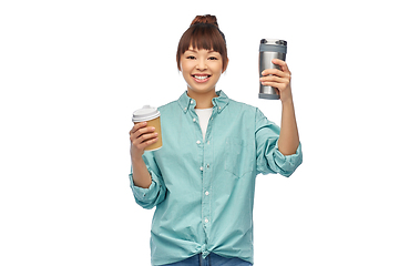 Image showing woman with thermo cup or tumbler for hot drinks