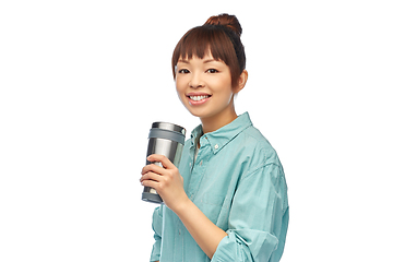 Image showing woman with thermo cup or tumbler for hot drinks