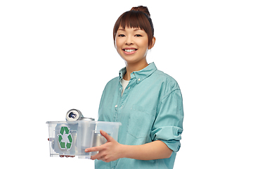Image showing smiling young asian woman sorting metallic waste