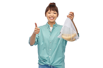 Image showing happy woman with bananas in reusable net bag