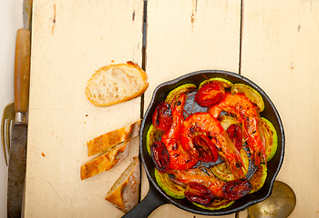 Image showing roasted shrimps with zucchini and tomatoes