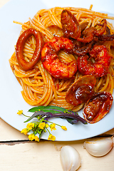 Image showing Italian seafood spaghetti pasta on red tomato sauce